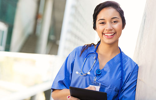 smiling woman in medical smock