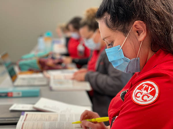 nursing student reading textbook