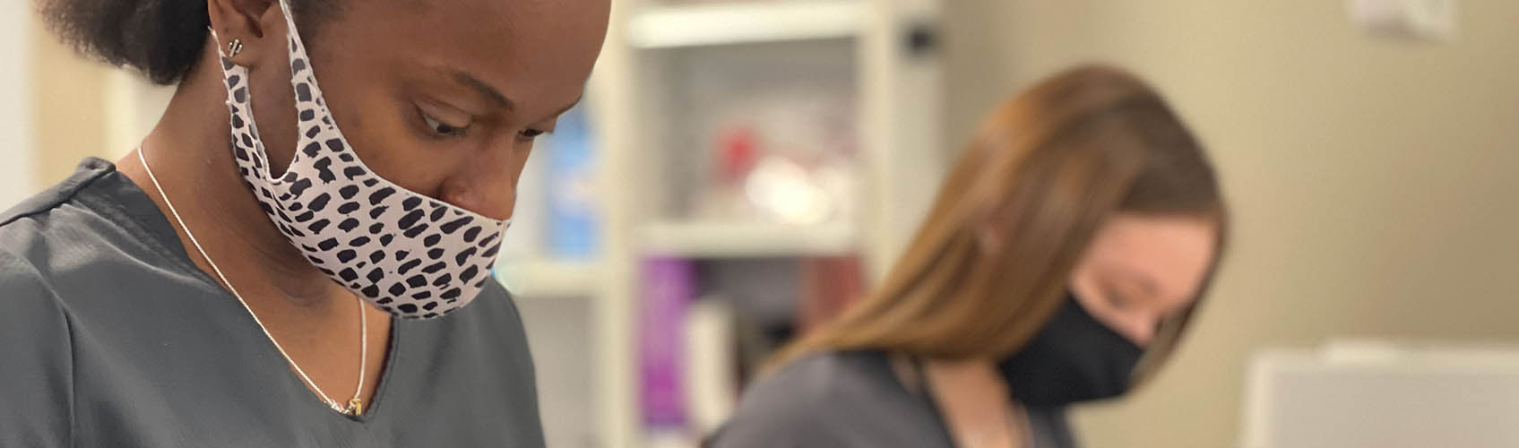 Woman nursing student working on simulated patient